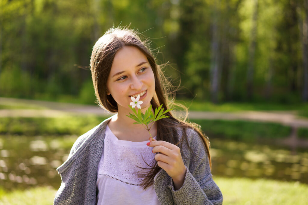 Portrait Cute Happy Woman Background Lake Holding Flower Her Face Sunny Spring Day